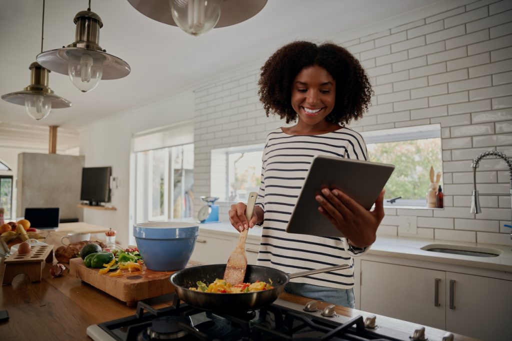 Happy Lady Cooking In The Kitchen